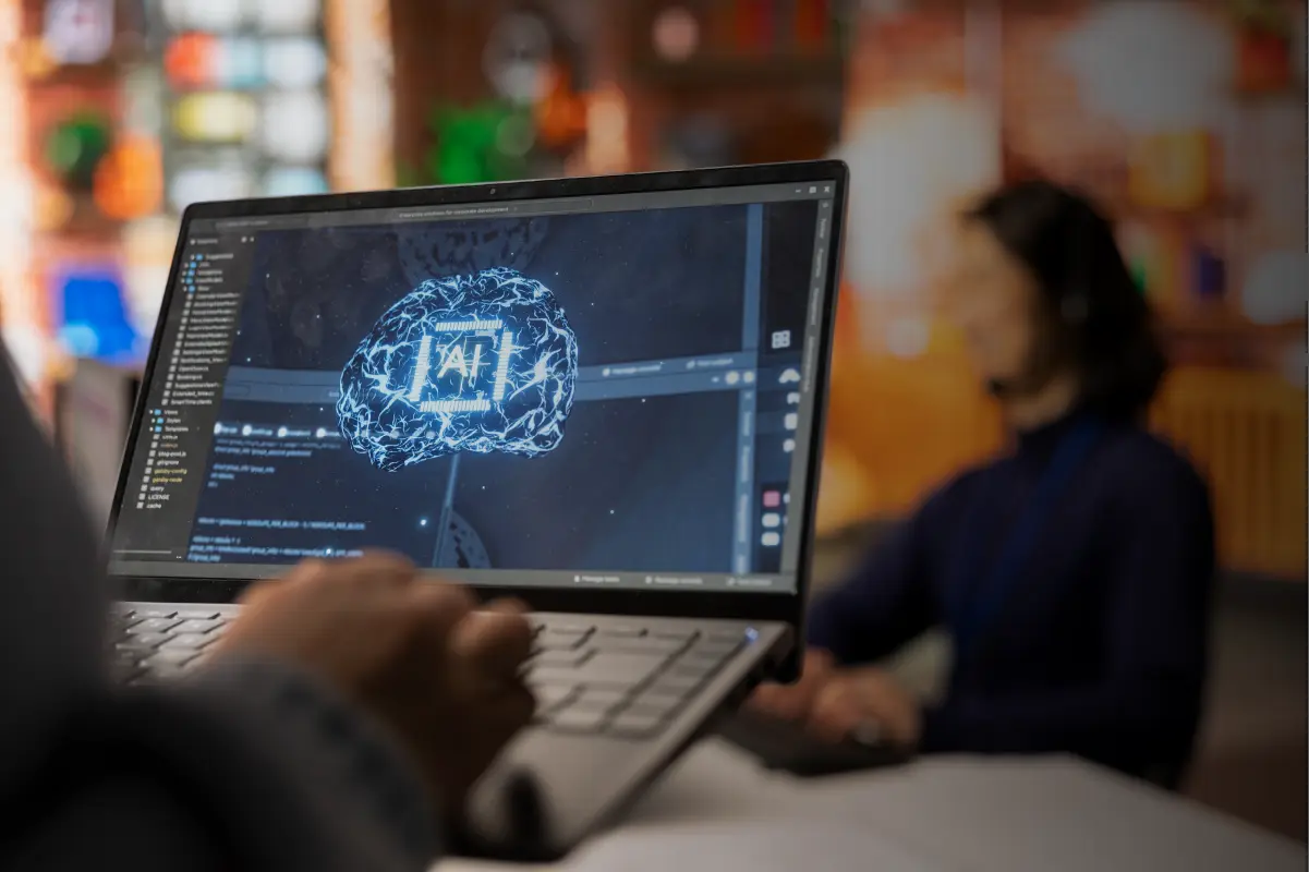 Businessman with his laptop to train an AI agent